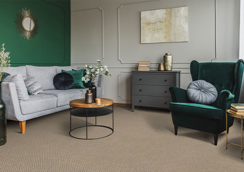 beige carpet in living room with vintage decor